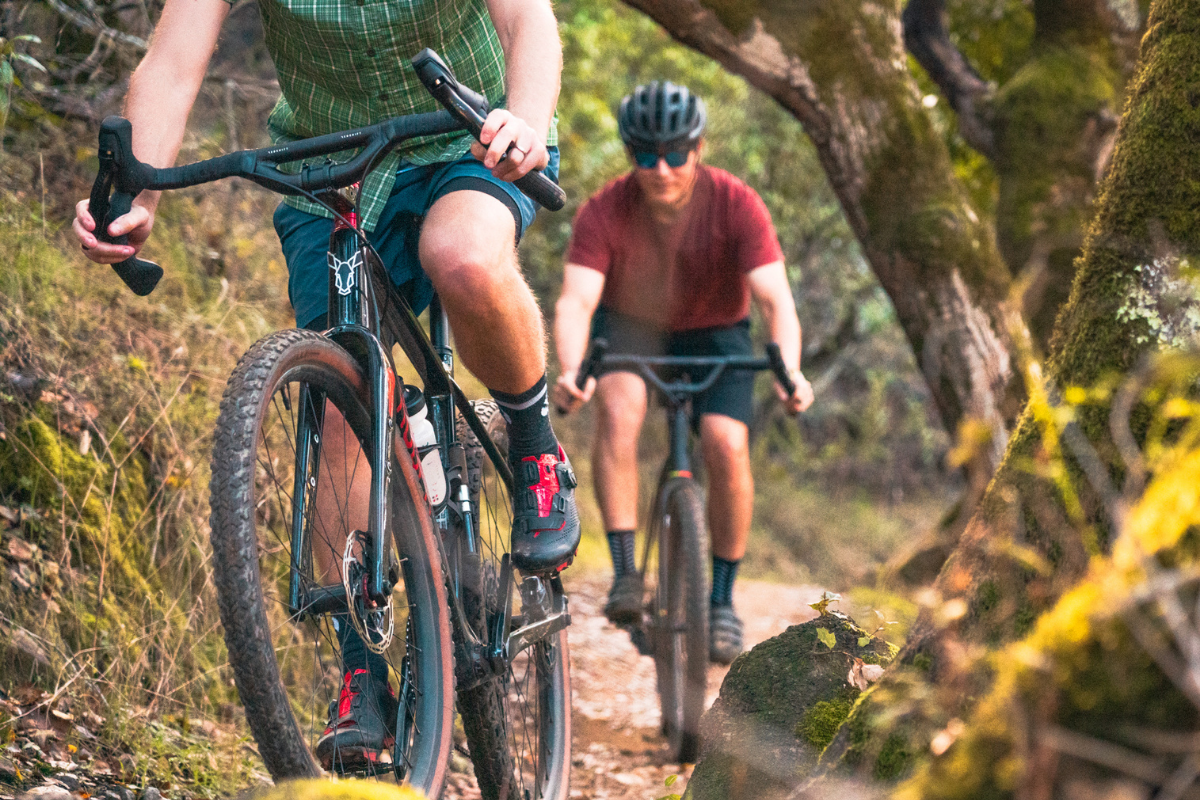 image of gravel bike riders with riser drop bars