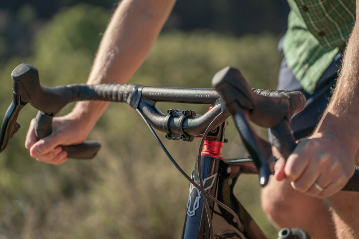 image of man riding bike with riser drop bars